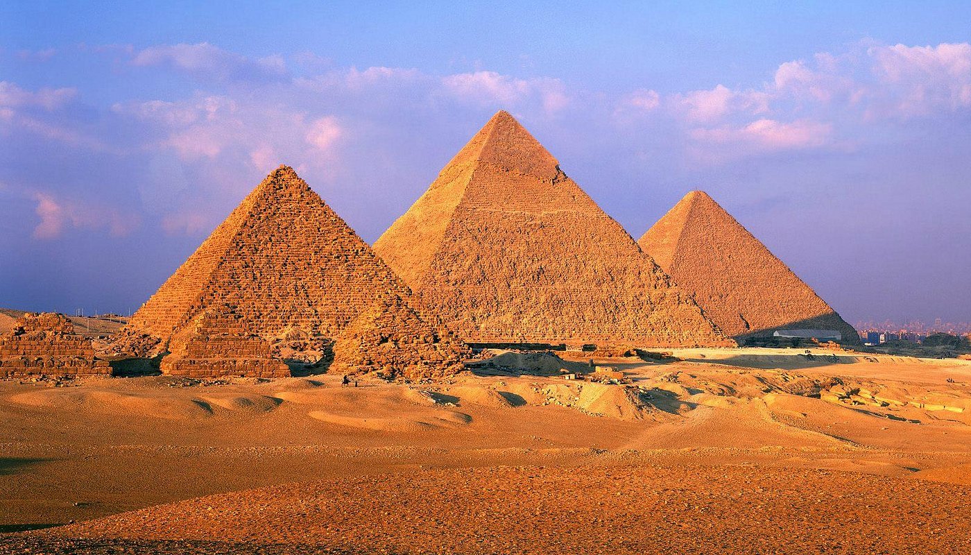 The three pyramids of Giza at sunset